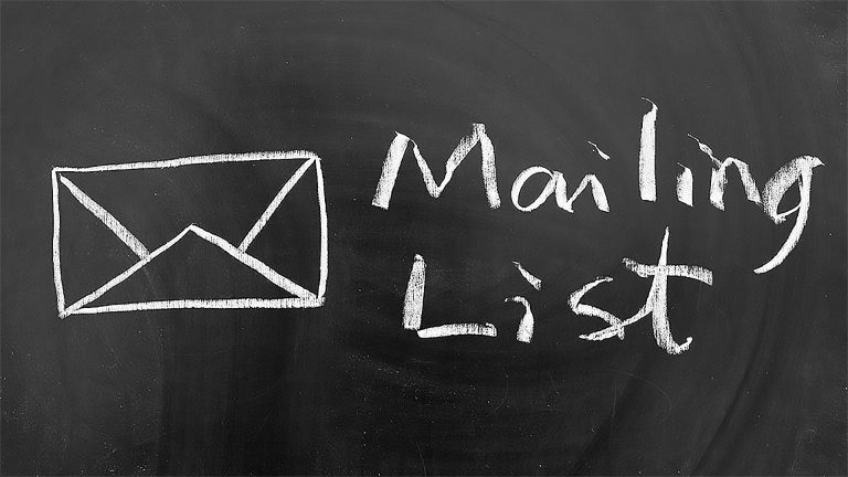 An envelope icon and the words "Mailing List" drawn with white chalk on a black chalkboard.