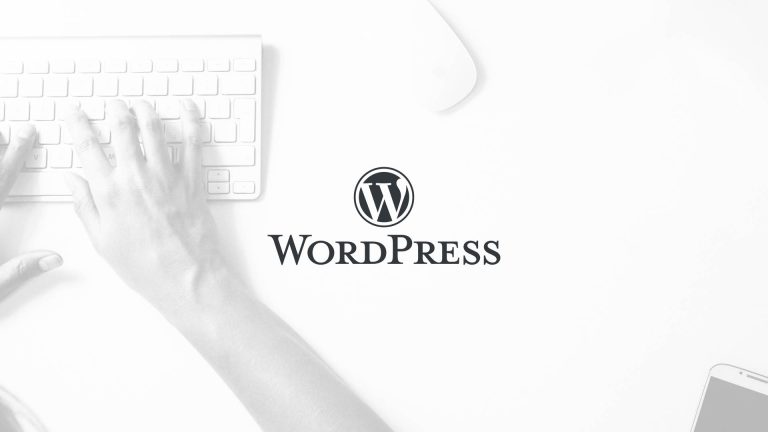 The black WordPress logo and wordmark over a light grey image of hands on a keyboard.