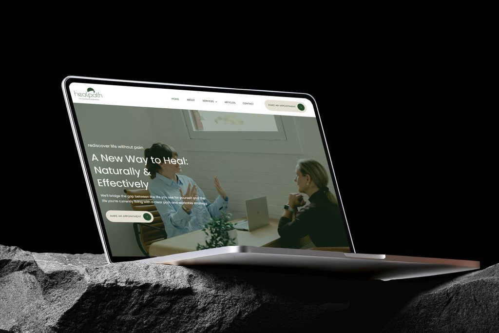 We Are Web Design Portfolio image showcasing the calming, professional website design for holistic pain management clinic Healpath on a laptop screen.